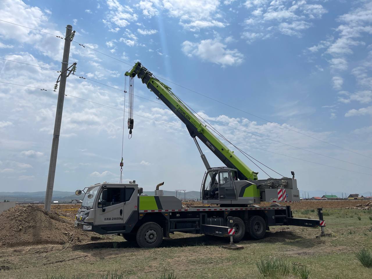 Crane operating in field